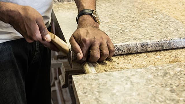 Normac employee installing countertop