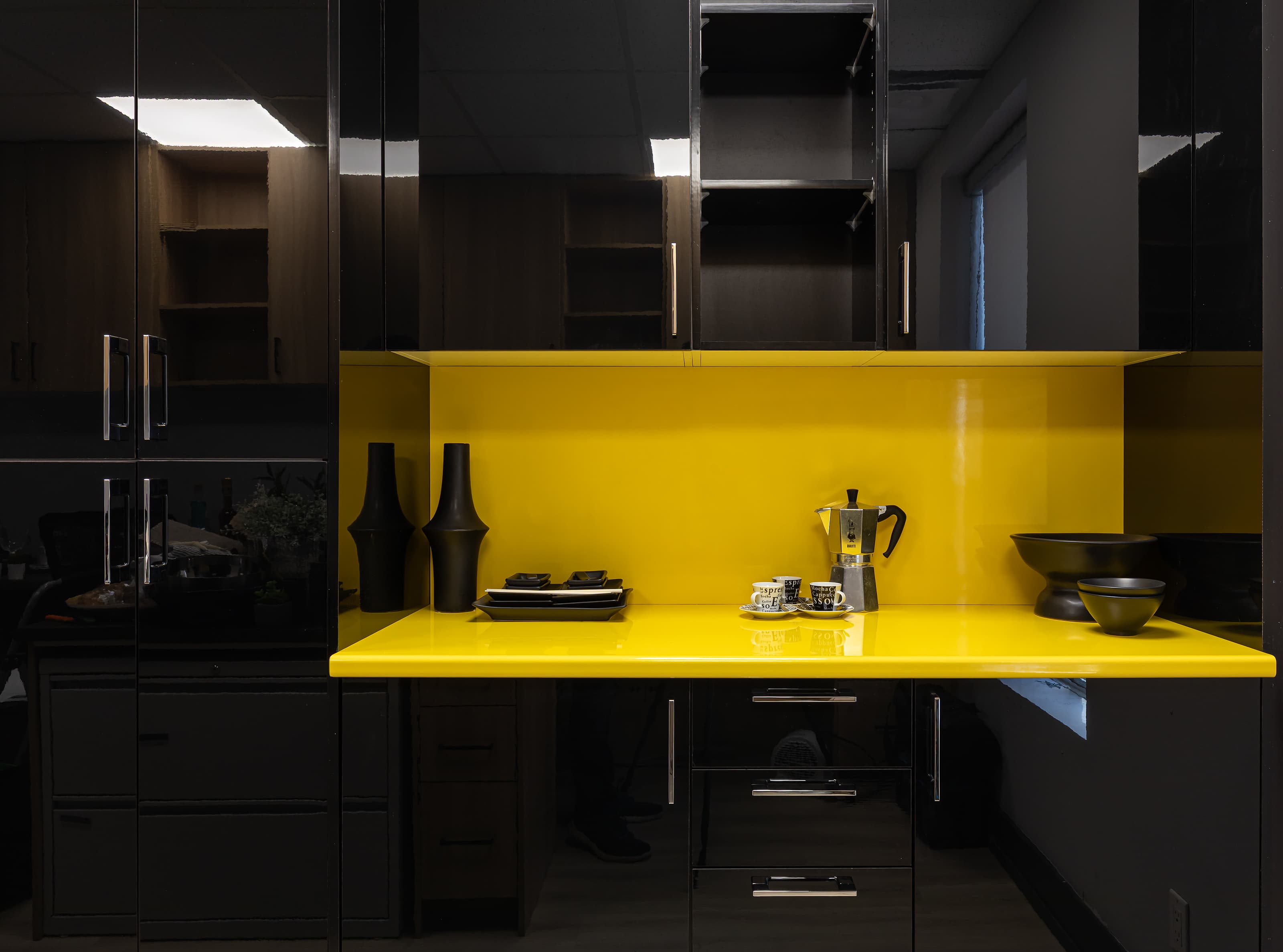 wide shot of black and yellow cabinetry